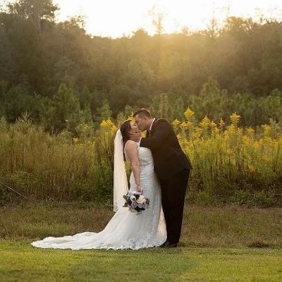 Photo of Melissa Ponzio's daughter, Jessy Alfonso sharing a kiss with her husband in their wedding ceremony.